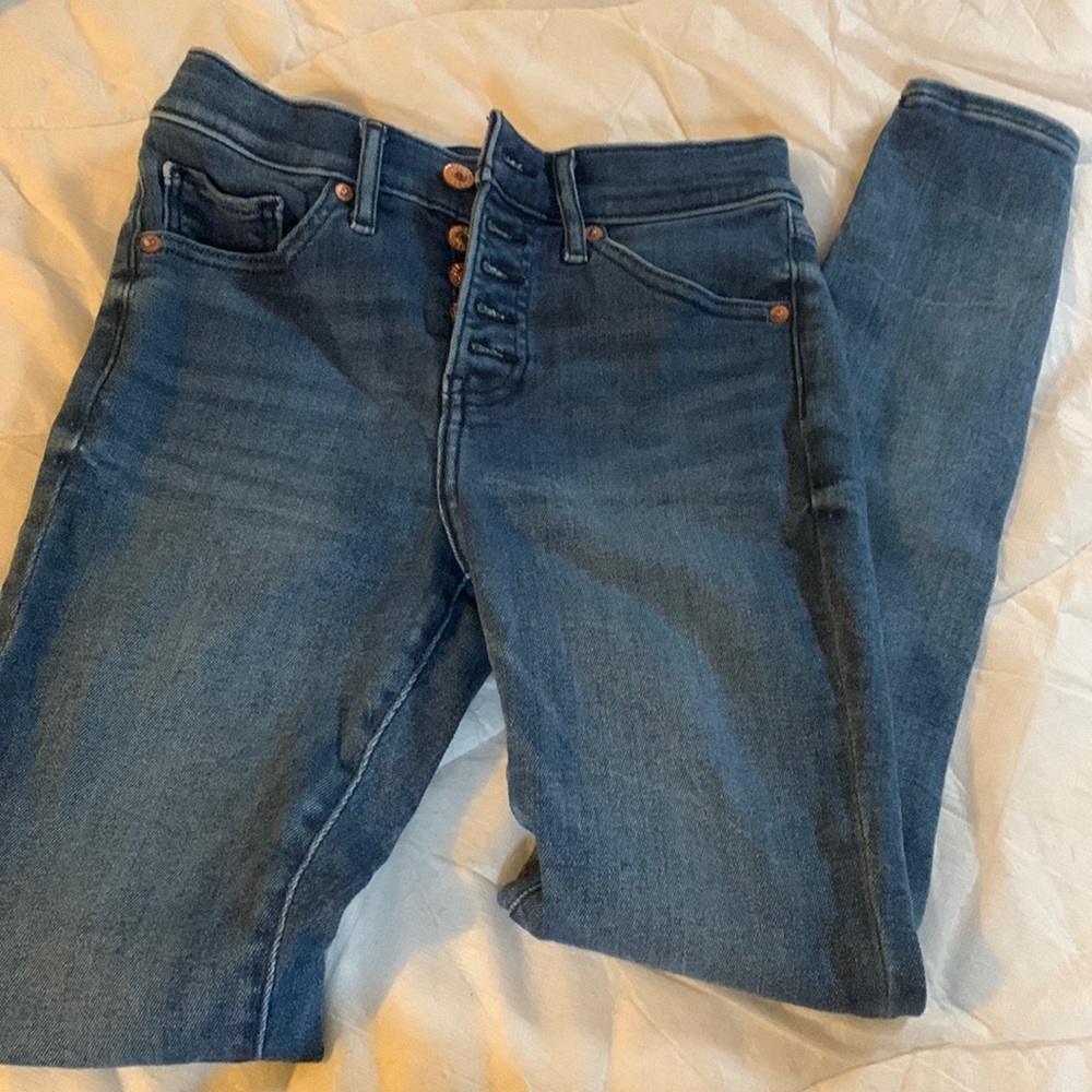 Express button fly skinny jeans.